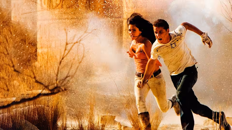 Sam Witwicky (Shia LaBeouf) and Mikaela Banes (Megan Fox) running through dusty ruins