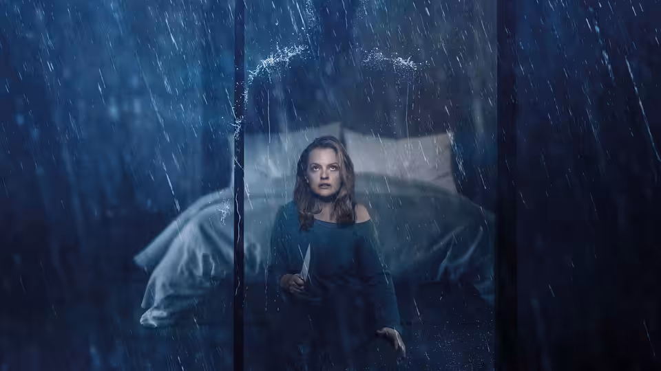 A woman sits on a bed behind rain-streaked glass, clutching a small object