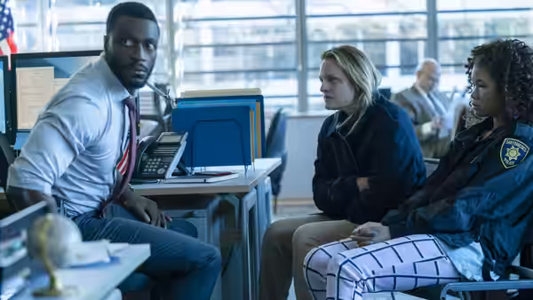 James Lanier (Aldis Hodge), Cecilia Kass (Elisabeth Moss) and Sydney Lanier (Storm Reid) sit in a police station
