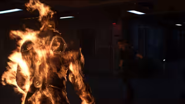 A figure engulfed in flames from behind in a dark corridor as a woman reacts
