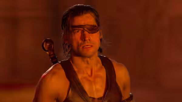 Horus (Nikolaj Coster-Waldau) stares ahead with an eyepatch in dim light