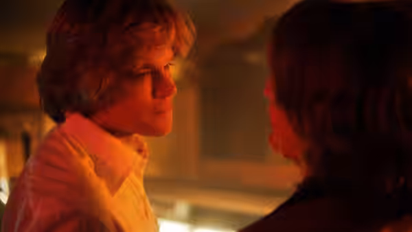 Scott Thorson (Matt Damon) facing Liberace (Michael Douglas) in a dimly lit room