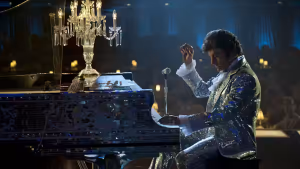 Liberace (Michael Douglas) performing at the piano on stage
