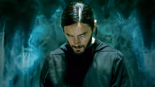 Dr. Michael Morbius (Jared Leto) looking down in swirling blue smoke