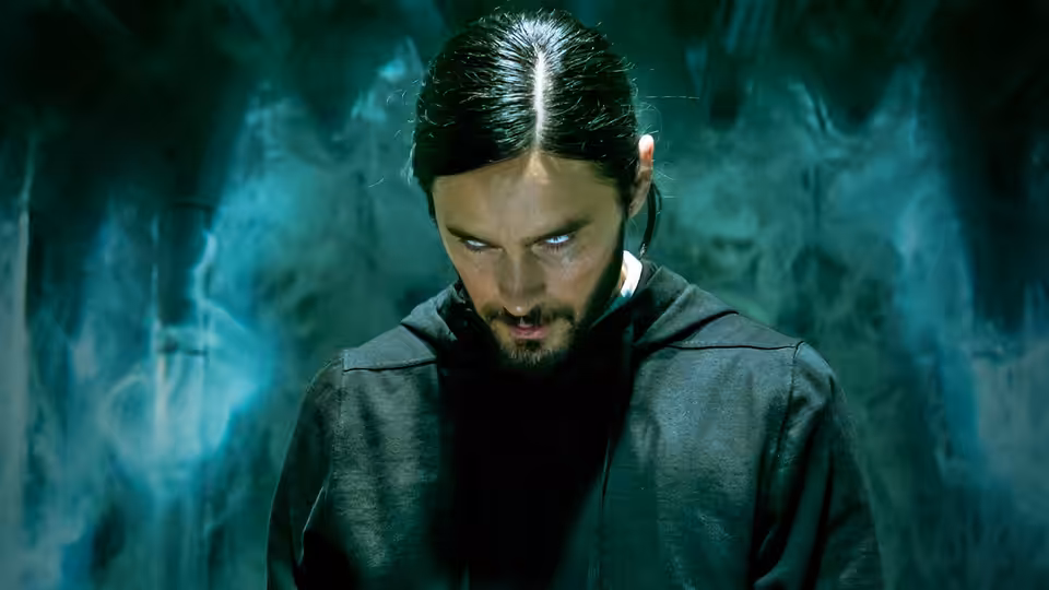 Dr. Michael Morbius (Jared Leto) looking down in swirling blue smoke