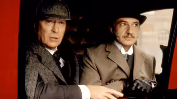 Sherlock Holmes (Michael Caine) and Dr. John Watson (Ben Kingsley) ride together in a carriage