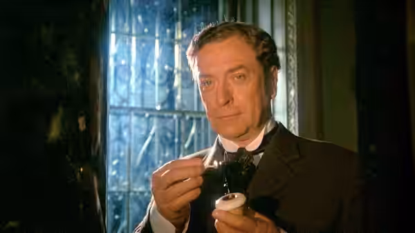 Sherlock Holmes (Michael Caine) holds his pipe beside a window