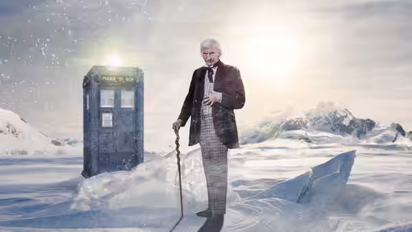 William Hartnell as the Doctor standing with cane beside the TARDIS in snow