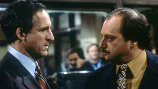 Two officers facing each other in serious conversation