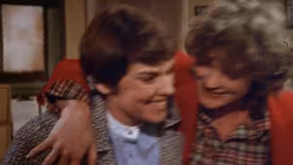 Mary Beth Lacey (Tyne Daly) and Christine Cagney (Sharon Gless) embracing indoors