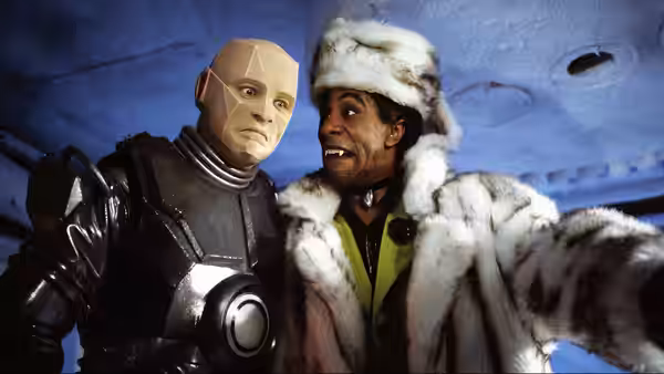Kryten (Robert Llewellyn) and Cat (Danny John-Jules) taking a selfie together