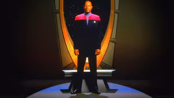 Benjamin Sisko (Avery Brooks) standing on the bridge in uniform
