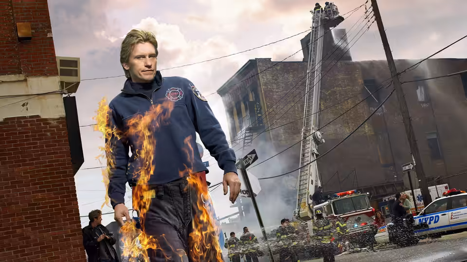 Tommy Gavin (Denis Leary) walking while on fire past a burning building