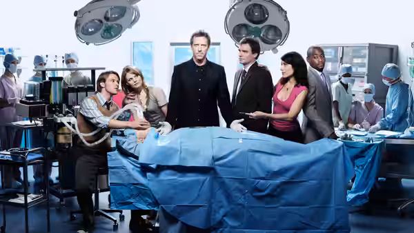 Gregory House (Hugh Laurie) leading a surgical procedure in the operating room