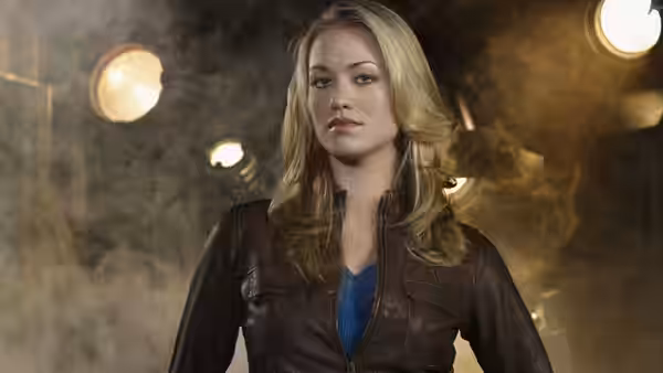 Sarah Walker (Yvonne Strahovski) standing in a smoky industrial space with lights