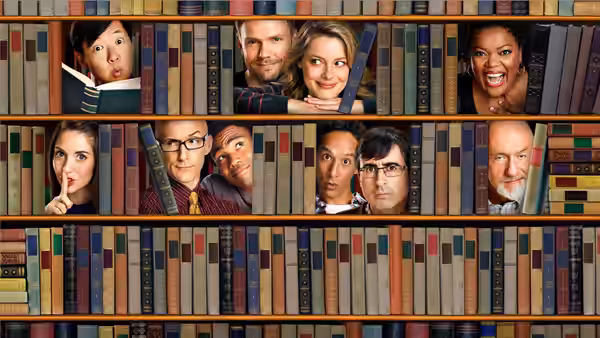 Cast members peer through gaps in a colorful library bookshelf