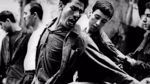 Young men struggling and shouting during a confrontation in the streets