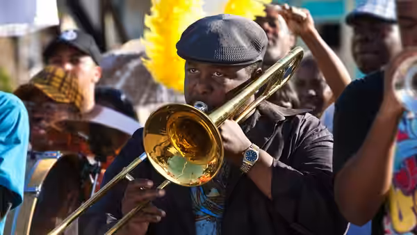 Antoine Batiste (Wendell Pierce) playing trombone in a street band