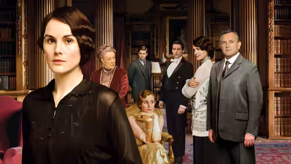 Michelle Dockery as Mary Crawley stands before family in a grand library