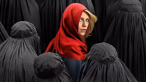 Carrie Mathison (Claire Danes) in a red headscarf among women in black burqas
