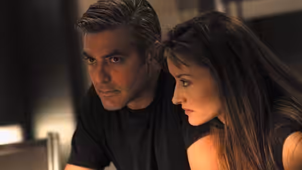 Chris Kelvin (George Clooney) and Rheya (Natascha McElhone) looking intently aside