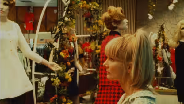 Wanda (Barbara Loden) looks across a shop floor lined with mannequins and clothing displays