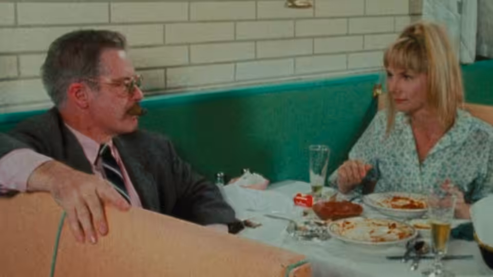 Wanda (Barbara Loden) sits across from Mr. Dennis (Michael Higgins) at a diner table