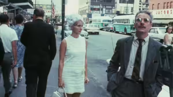 Wanda (Barbara Loden) walks beside Mr. Dennis (Michael Higgins) through a city street