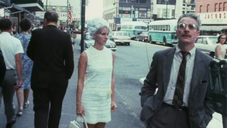 Wanda (Barbara Loden) walks beside Mr. Dennis (Michael Higgins) through a city street