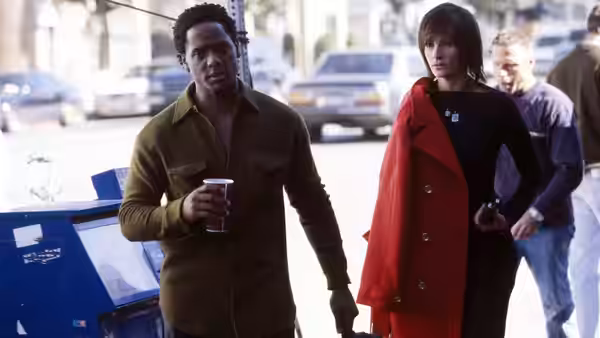 Blair Underwood and Catherine Keener walking along a city street