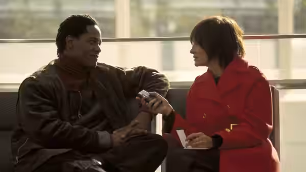 Blair Underwood and Catherine Keener sitting on a bench