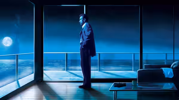 Lt. Vincent Hanna (Al Pacino) standing by ocean-view windows at night