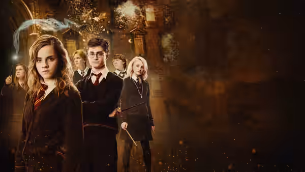 Harry Potter (Daniel Radcliffe) and Hermione Granger (Emma Watson) before a burning building