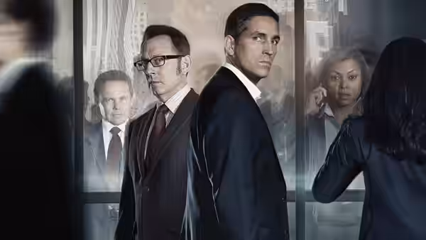 Harold Finch (Michael Emerson) and John Reese (Jim Caviezel) in an office