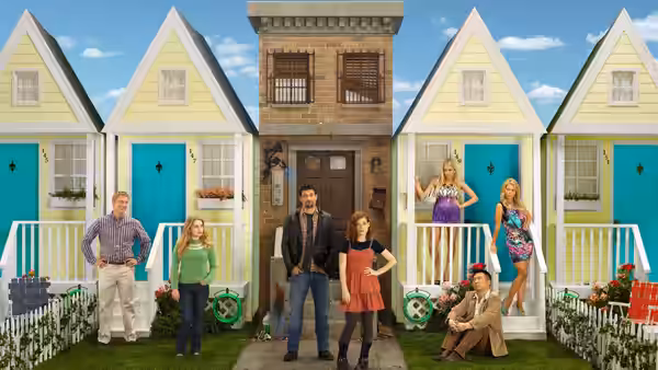 George Altman (Jeremy Sisto) and Tessa Altman (Jane Levy) pose before colorful suburban houses