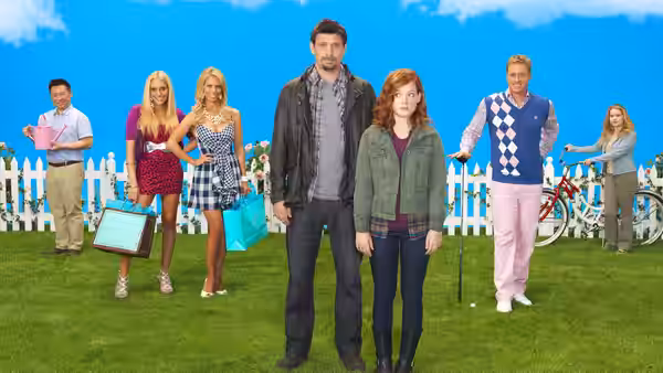 George Altman (Jeremy Sisto) and Tessa Altman (Jane Levy) stand with neighbors on a lawn