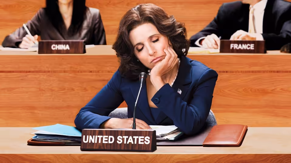 Selina Meyer (Julia Louis-Dreyfus) rests her chin on her hand at the United States desk