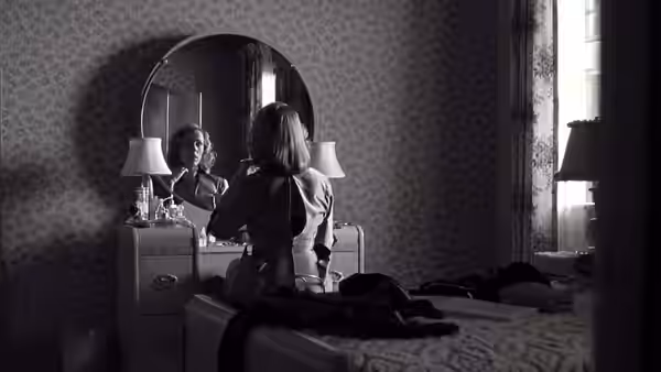 Birdy Abundas (Scarlett Johansson) seated at her bedroom vanity mirror