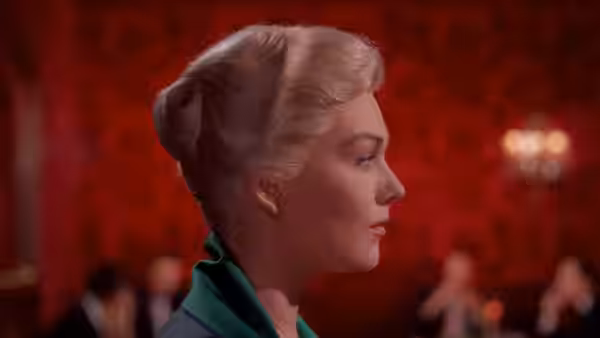 Madeleine (Kim Novak) in profile with blonde hair in an updo