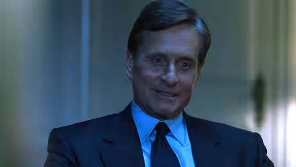 Robert Wakefield (Michael Douglas) wearing a dark suit and tie