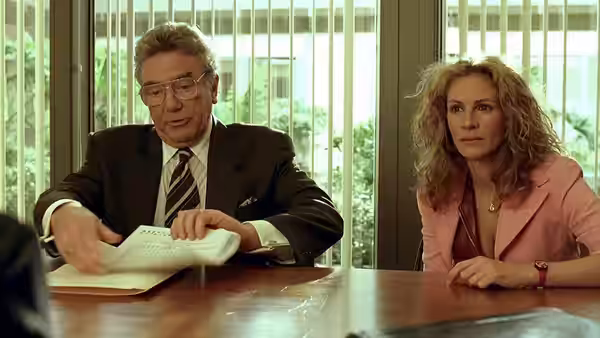 Ed Masry (Albert Finney) and Erin Brockovich (Julia Roberts) reviewing papers at a table