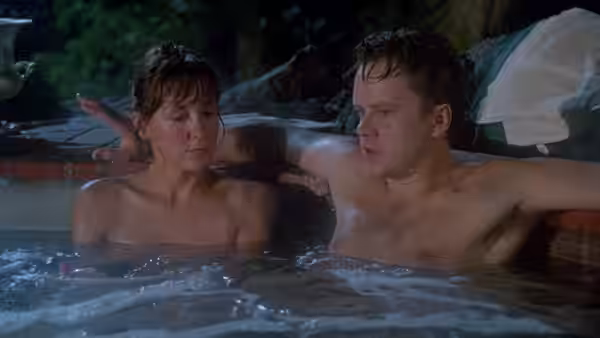 Griffin Mill (Tim Robbins) and June Gudmundsdottir (Greta Scacchi) in a nighttime hot tub
