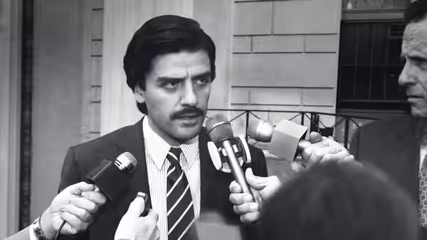 Nick Wasicsko (Oscar Isaac) faces microphones at a press event