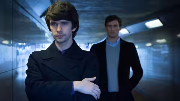 Danny (Ben Whishaw) and Alex (Edward Holcroft) in an underground corridor