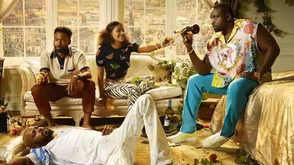Four friends relaxing together in a sunlit living room