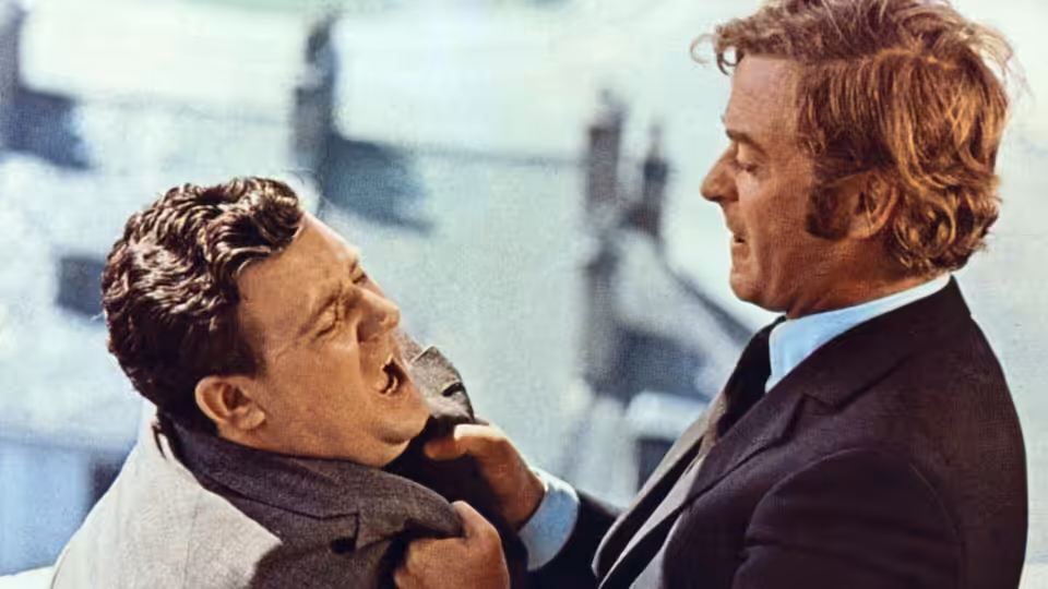 Jack Carter (Michael Caine) gripping Eric (Ian Hendry) by the collar