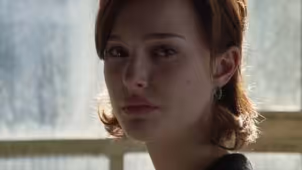 Anna (Julia Roberts) looks ahead beside a window