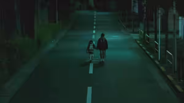 A boy walks hand in hand with a little girl along a quiet night street