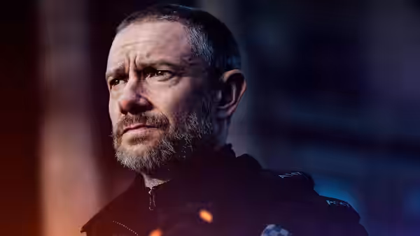 Chris Carson (Martin Freeman) turning his head with a serious expression