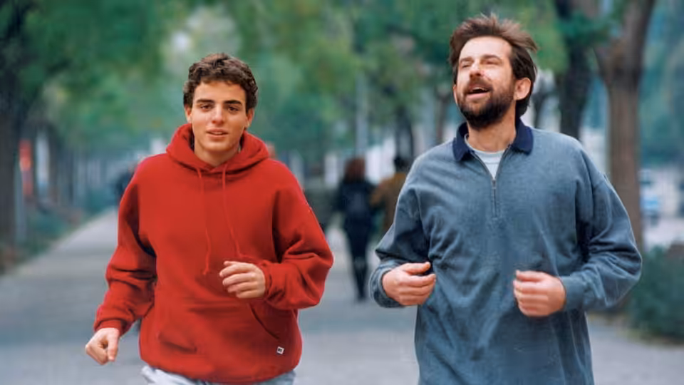 Giovanni (Nanni Moretti) jogs beside his son Andrea along a tree-lined path